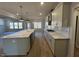 Open-concept kitchen with a large island, stainless steel appliances, and hardwood floors at 25 Accord Dr, Youngsville, NC 27596