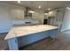Spacious kitchen with a large island, stainless steel appliances, and modern finishes at 25 Accord Dr, Youngsville, NC 27596