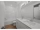 Bright bathroom featuring a double vanity and shower/tub combo at 2995 Faucette Ln, Burlington, NC 27217