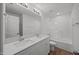 Bright bathroom featuring double sinks, framed mirror, and shower-tub combination at 2995 Faucette Ln, Burlington, NC 27217