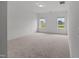 Spacious bedroom with two windows and neutral carpeting at 2995 Faucette Ln, Burlington, NC 27217