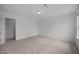 Clean bedroom showing neutral carpet and a walk-in closet at 2995 Faucette Ln, Burlington, NC 27217