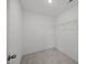 Walk-in closet with neutral carpet and a single wire shelf at 2995 Faucette Ln, Burlington, NC 27217