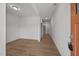 Entryway with wood-look flooring, neutral walls, and a view down a hallway at 2995 Faucette Ln, Burlington, NC 27217