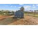 The blue home has a yard of dirt and grass at 2995 Faucette Ln, Burlington, NC 27217