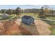 The house has a blue exterior and is surrounded by a lot of dirt at 2995 Faucette Ln, Burlington, NC 27217