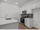 Bright kitchen with quartz countertops and stainless steel appliances at 2995 Faucette Ln, Burlington, NC 27217