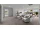 Spacious main bedroom boasts plush carpet, an ensuite, and a serene sitting area with natural light at 2995 Faucette Ln, Burlington, NC 27217