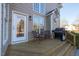 Cozy back porch with outdoor seating and a barbecue grill, perfect for entertaining at 30155 Pharr, Chapel Hill, NC 27517