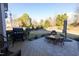 Well-maintained backyard with stone patio, grill, and inviting dining area for outdoor enjoyment at 30155 Pharr, Chapel Hill, NC 27517