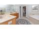This bathroom includes a vanity with cream counters, tile floor, and a walk in closet at 30155 Pharr, Chapel Hill, NC 27517