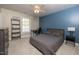 This bedroom offers neutral walls, blue accent wall, carpet, and a ceiling fan at 30155 Pharr, Chapel Hill, NC 27517