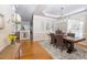 Formal dining room featuring a large wood table with view into the living room at 30155 Pharr, Chapel Hill, NC 27517