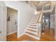 Bright foyer with hardwood floors, staircase and view into the living room at 30155 Pharr, Chapel Hill, NC 27517