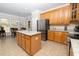 Kitchen with stainless steel appliances, island and view into eat-in kitchen at 30155 Pharr, Chapel Hill, NC 27517