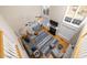 Aerial view of the living room with a cozy fireplace, large windows and blue accent rug at 30155 Pharr, Chapel Hill, NC 27517