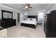 This main bedroom features a tray ceiling, black furniture and neutral-colored walls at 30155 Pharr, Chapel Hill, NC 27517
