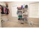 This walk-in closet features wire shelving, natural light, and carpet floors at 30155 Pharr, Chapel Hill, NC 27517