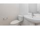 Small bathroom with pedestal sink and toilet at 3021 Polanski Dr, Wake Forest, NC 27587