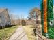 Stone and brick community entrance and paved walking trail with lush landscaping at 3021 Polanski Dr, Wake Forest, NC 27587