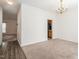 Bright dining room with a chandelier and neutral carpeting at 3021 Polanski Dr, Wake Forest, NC 27587