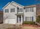 Traditional two-story home with gray siding and a well-maintained front yard, providing a cozy, suburban feel at 3021 Polanski Dr, Wake Forest, NC 27587