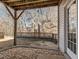 Covered patio with stone flooring and wooded view at 3021 Polanski Dr, Wake Forest, NC 27587