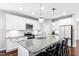 Modern kitchen with granite island and stainless steel appliances at 313 Crossland Dr, Chapel Hill, NC 27517