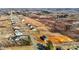 An aerial view displays a long street with newly constructed homes and natural landscapes in the background at 3615 Nc-62, Burlington, NC 27217