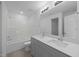 Stylish bathroom featuring double sinks, modern fixtures, and a tub-shower combo at 3615 Nc-62, Burlington, NC 27217