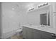 Bright bathroom features tile floors, double sink vanity, a bathtub-shower combo and a large mirror at 3615 Nc-62, Burlington, NC 27217