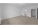Bright, carpeted bedroom featuring neutral walls and a light fixture on the ceiling at 3615 Nc-62, Burlington, NC 27217