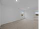 Bedroom with neutral carpet, a window overlooking the backyard, and recessed lighting at 3615 Nc-62, Burlington, NC 27217