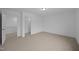 Spacious bedroom with carpet, neutral walls, ceiling light and doorways to other rooms at 3615 Nc-62, Burlington, NC 27217