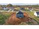 Back view of home features blue siding, dark roof, and newly prepared yard at 3615 Nc-62, Burlington, NC 27217