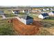 Back view of home features gray siding, dark roof, and newly prepared yard at 3615 Nc-62, Burlington, NC 27217
