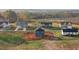 New construction home featuring a dark roof, blue siding, and an unfinished yard surrounded by other homes at 3615 Nc-62, Burlington, NC 27217
