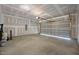 Spacious garage with a concrete floor and an open garage door, ready for use at 3615 Nc-62, Burlington, NC 27217