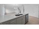 Kitchen island with a stainless steel sink, dishwasher and gray cabinets, great for prepping and serving at 3615 Nc-62, Burlington, NC 27217
