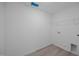 Spacious laundry room with tile flooring, utility connections, and wire shelving at 3615 Nc-62, Burlington, NC 27217