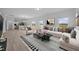 Open-concept living space with a modern kitchen, comfortable seating, and large windows offering natural light at 3615 Nc-62, Burlington, NC 27217