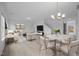 Bright living room featuring modern chandelier, neutral color palette, and inviting seating area at 3615 Nc-62, Burlington, NC 27217