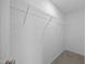 Walk-in closet features carpet and wire shelving, perfect for organizing clothes and accessories at 3615 Nc-62, Burlington, NC 27217