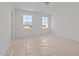 Well-lit bedroom featuring two large windows at 3649 Nc-62, Burlington, NC 27217