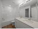 Bathroom with double sink, vanity, shower, and mirror at 3649 Nc-62, Burlington, NC 27217