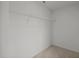 Interior view of a walk-in closet with white walls and wire shelving for storage at 3649 Nc-62, Burlington, NC 27217
