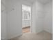 Walk-in closet shows wire shelving, carpet, and an adjoining bathroom at 3649 Nc-62, Burlington, NC 27217