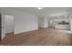 Spacious living area featuring hardwood flooring, neutral walls, and open access to other rooms at 3649 Nc-62, Burlington, NC 27217