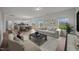 Open-concept living room with hardwood floors, large windows, and access to the backyard at 3649 Nc-62, Burlington, NC 27217