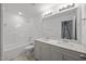 Bright bathroom with dual sink vanity, modern lighting, and a bathtub, creating a relaxing retreat at 3655 Nc-62, Burlington, NC 27217